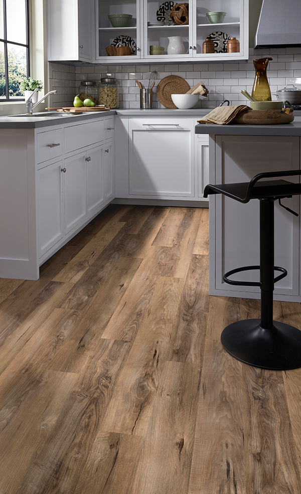 A 2020 themed kitchen with off white cabinets, grey countertops, and backsplash subway tile on trending luxury vinyl floors.