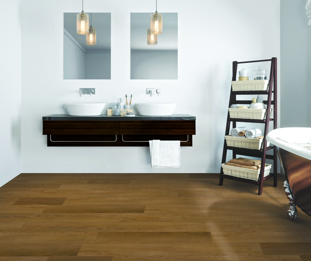 wood look flooring in bathroom with floating vanities installation and soaker tub